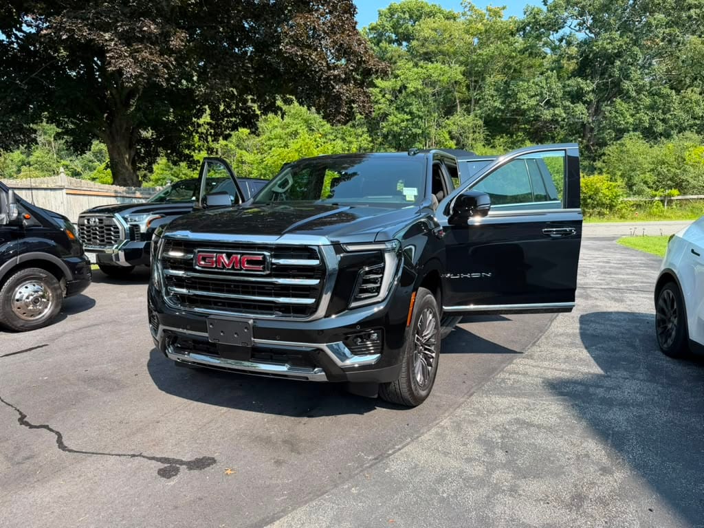 GMC SUV stretch limo, front three-quarter exterior view