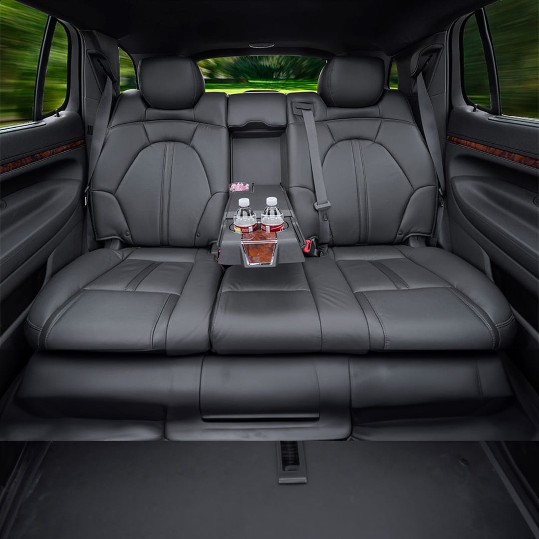 Lincoln MKT Town Car-style sedan rear bench seat with center armrest and bottled water
